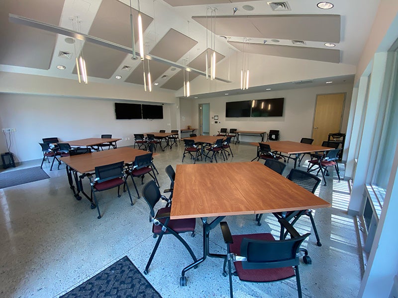 Large room with tables arranged in clusters