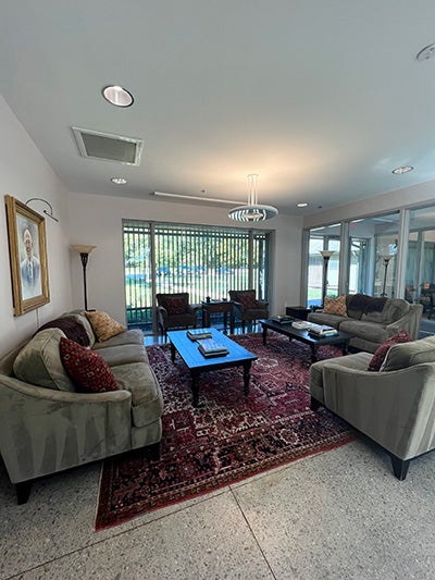 Comfortable chairs in a lounge beside the lobby.