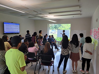 A group of people engaged in collaborative discussions.